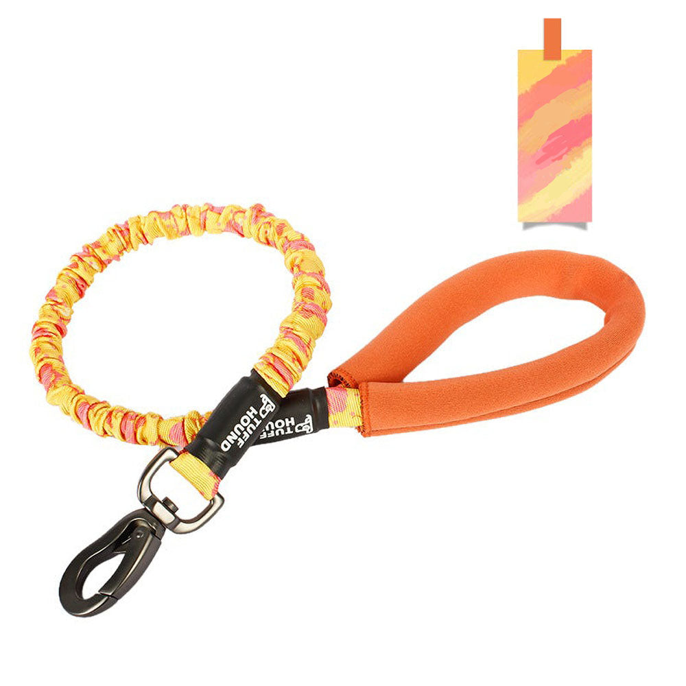 Orange TuffHound Recoil™ - Bungee Dog Leash on a white background.