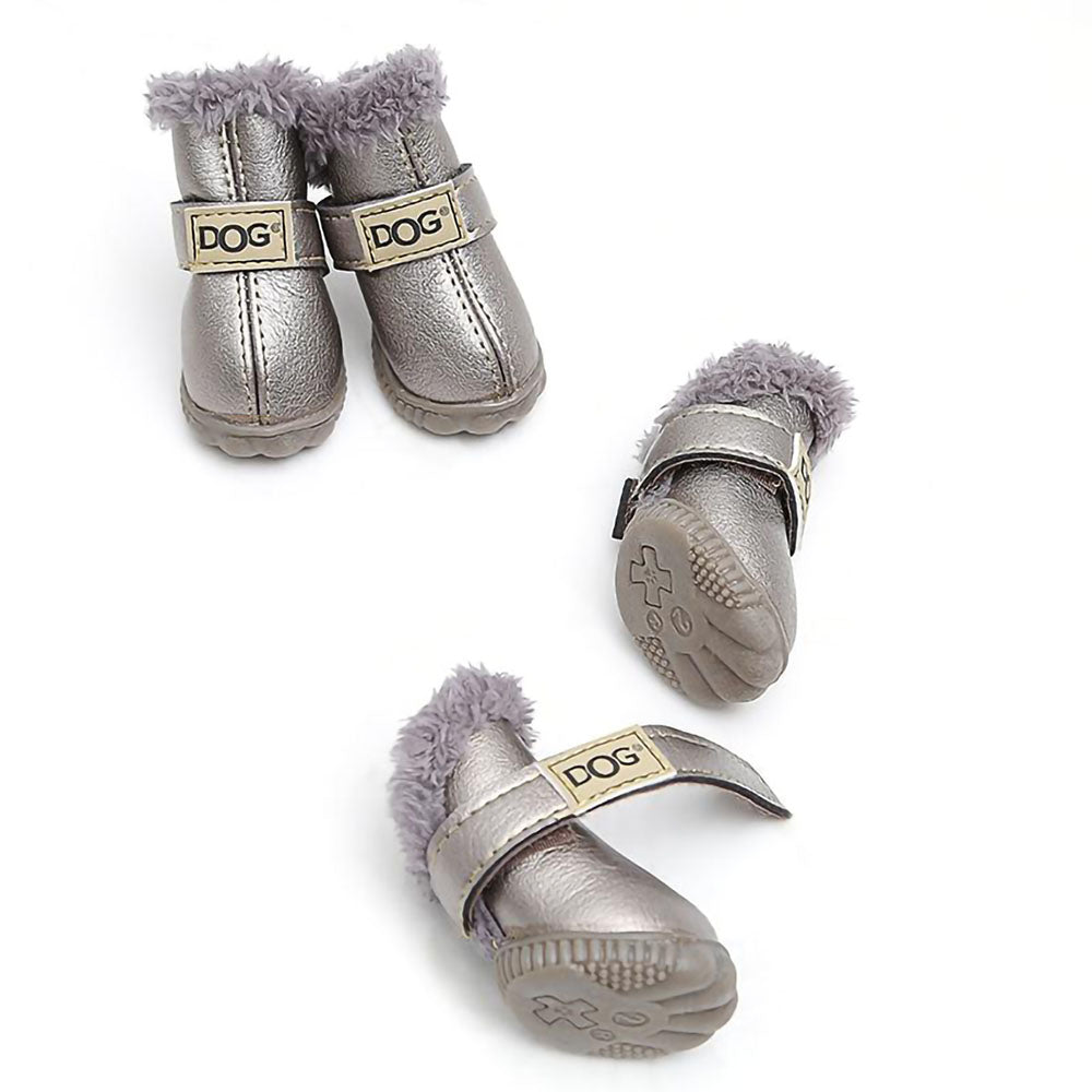 Lot of four silver Pup Ugg™ - Dog Winter Shoes on a white background. 