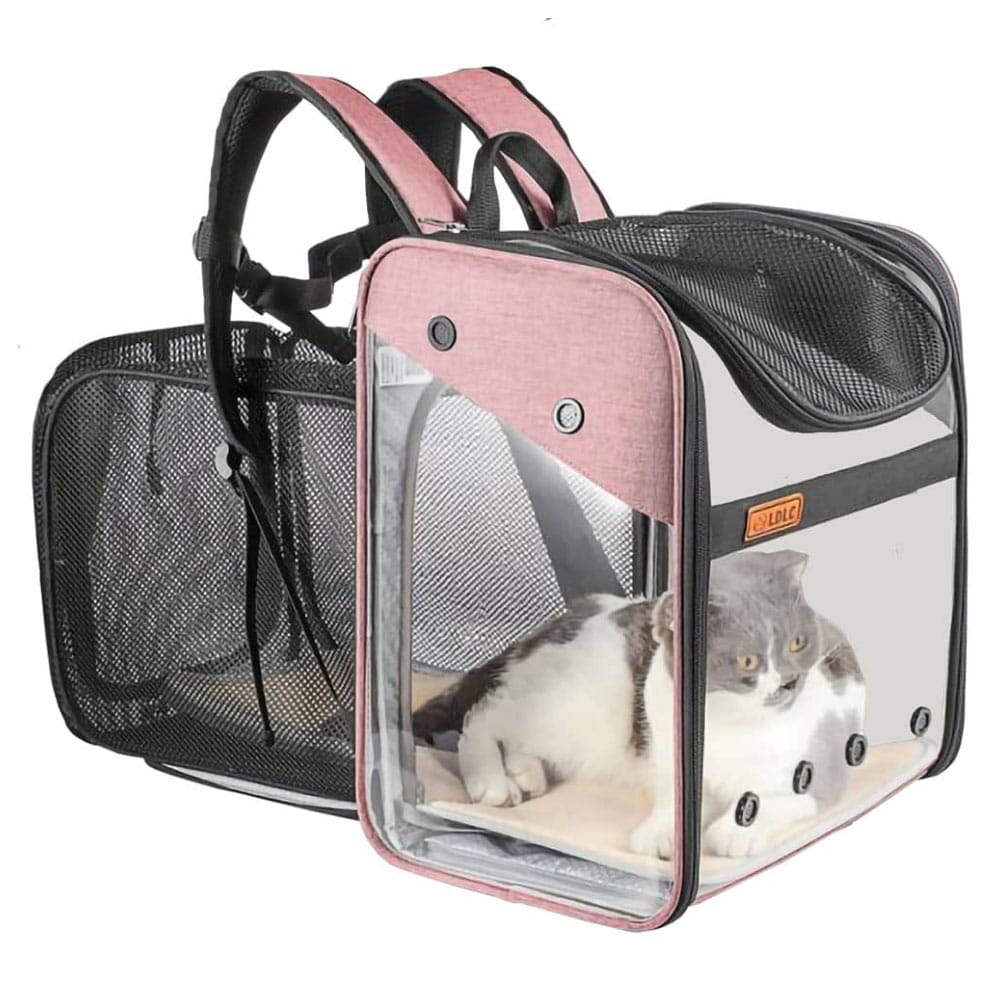Grey and white cat sitting inside a pink LD Loft Pet Backpack Carrier Expandable Transparent Airline-Approved fully expanded with backpack handless showing on a white background.
