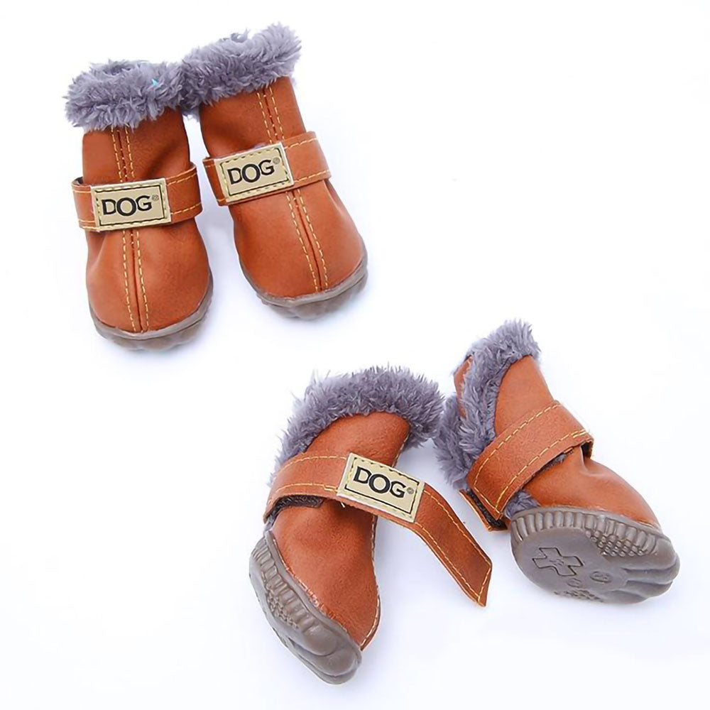 Lot of four brown Pup Ugg™ - Dog Winter Shoes on a white background. 