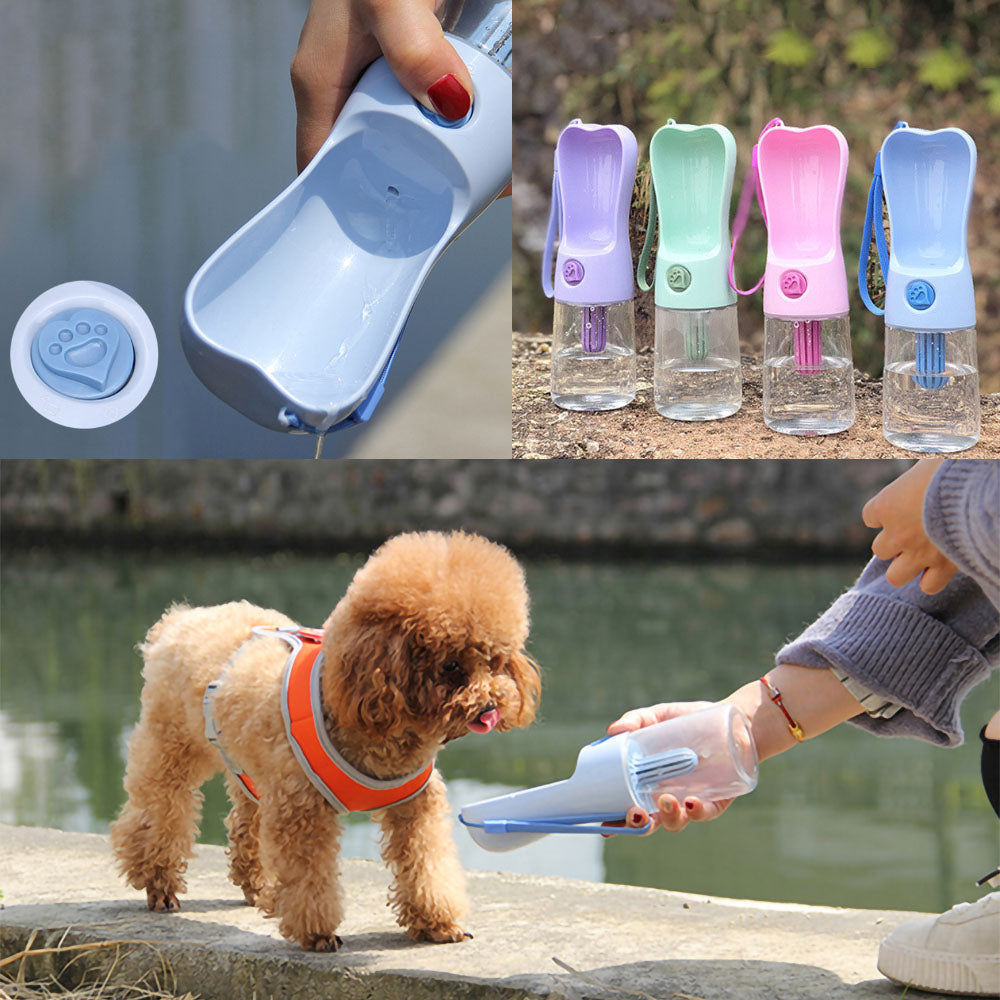 Close up of a hand holding and pressing the pour love button for a blue Products Heart™ - Pet Water Bottle on a vivid background with also a blue, green, pink and purple Heart™ - Pet Water Bottle on a white background and a small brown dog drinking water out of a blue Heart™ - Pet Water Bottle on a vivid background.