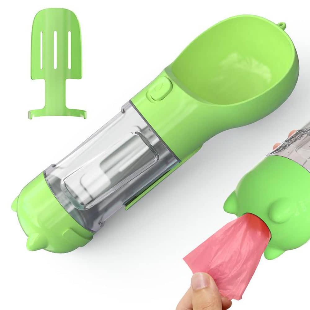 Green Scooper™ - Dog Water Bottle with scooper detachment showing and a red bag being pulled out of the back on a white background. 