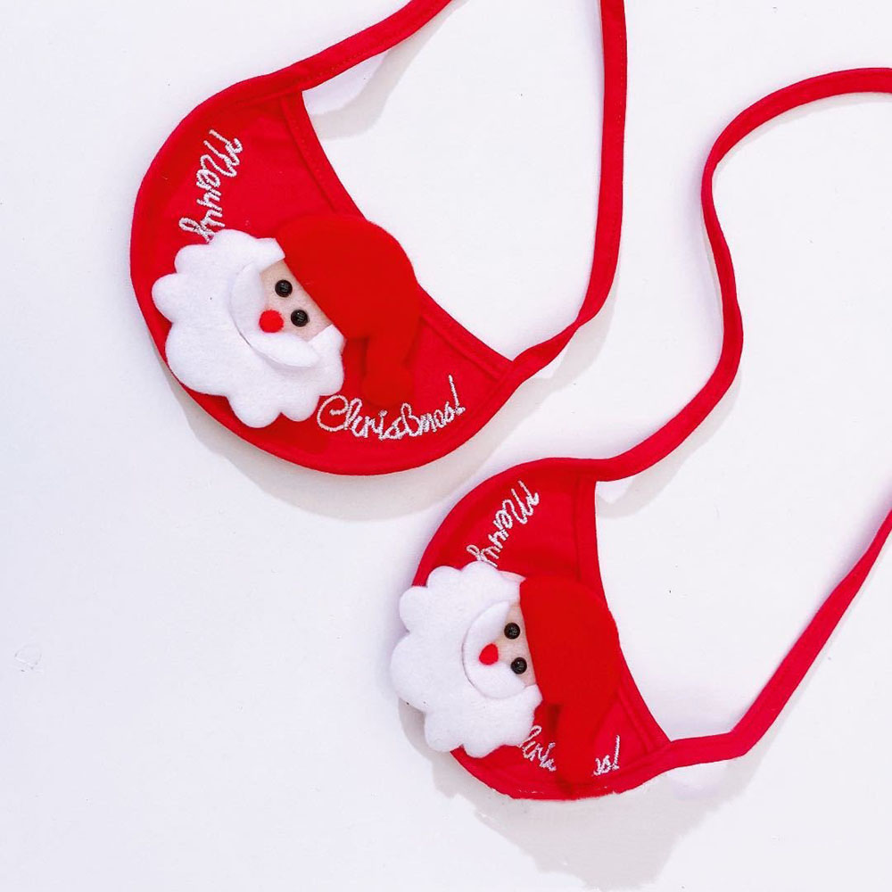 A pair of red Christmas Bibs on a white background. 