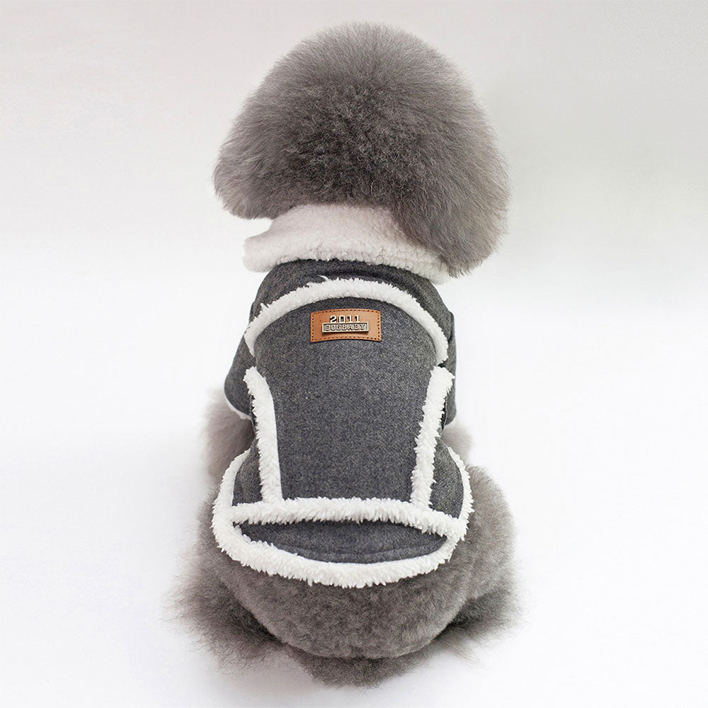 Small fluffy gray dog in a dark gray Dogbaby Snug - Dog Winter Jackets with faux fur trimmings on collar and as details around the vest on white background.