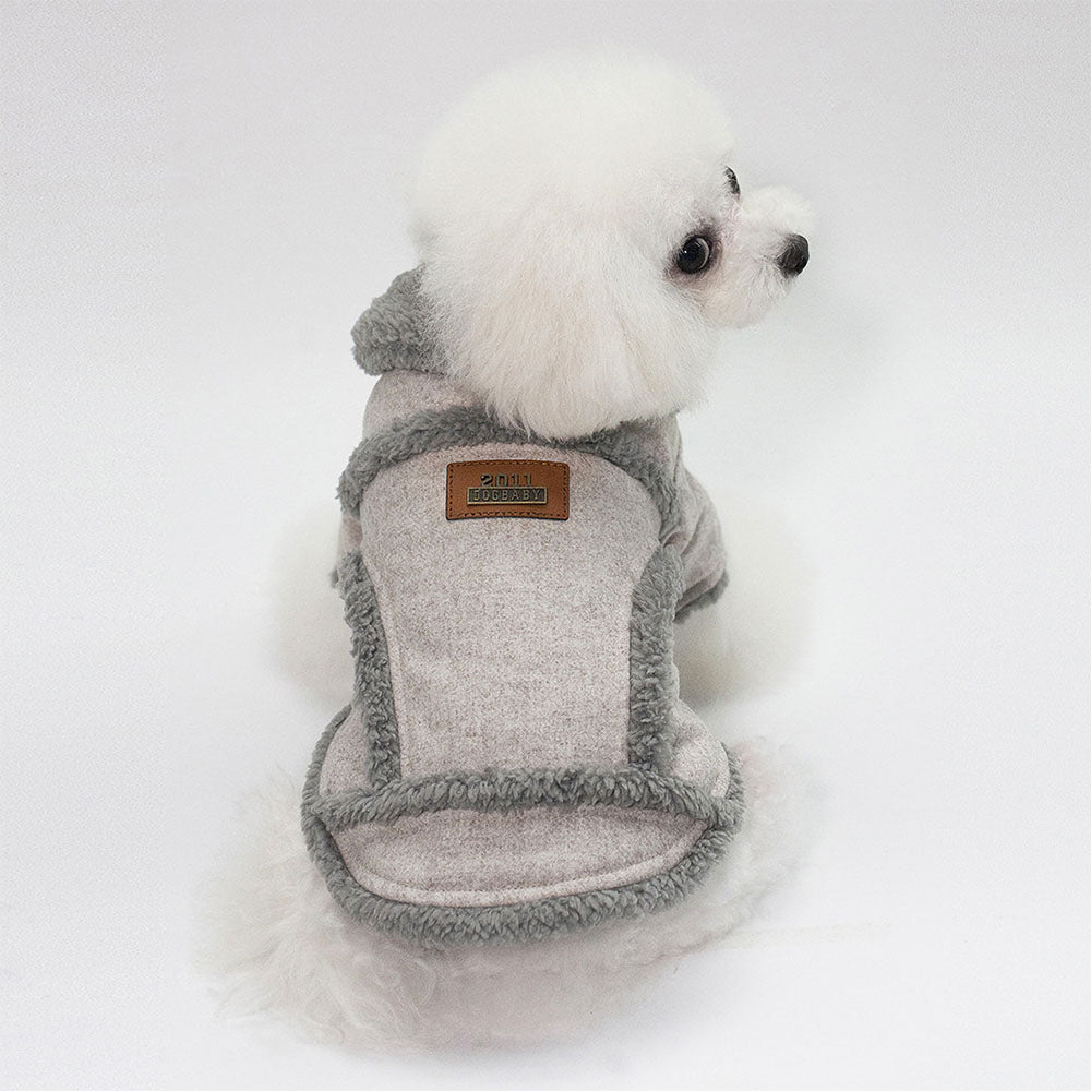 Small fluffy white dog in a light gray Dogbaby Snug - Dog Winter Jackets with faux fur trimmings on collar and as details around the vest on white background.