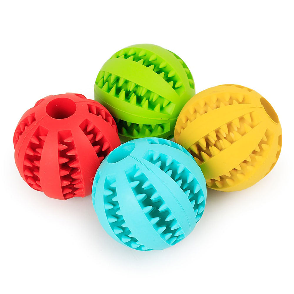Red, Green, Yellow and Teal Rubberino - Dog Chew Toy rubber ball on white background. 