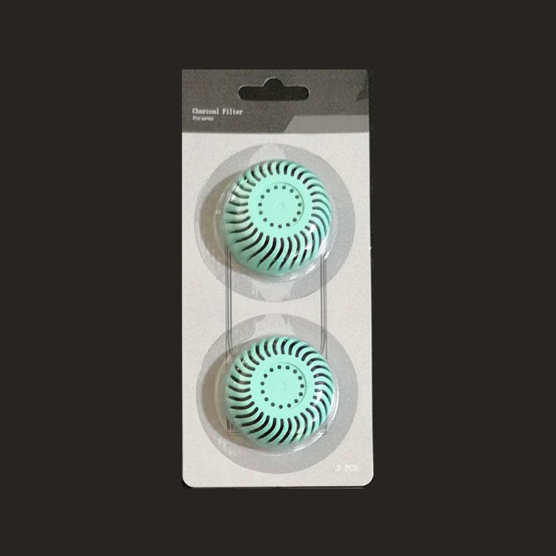 Green activated charcoal filter in a two pcs package on black background